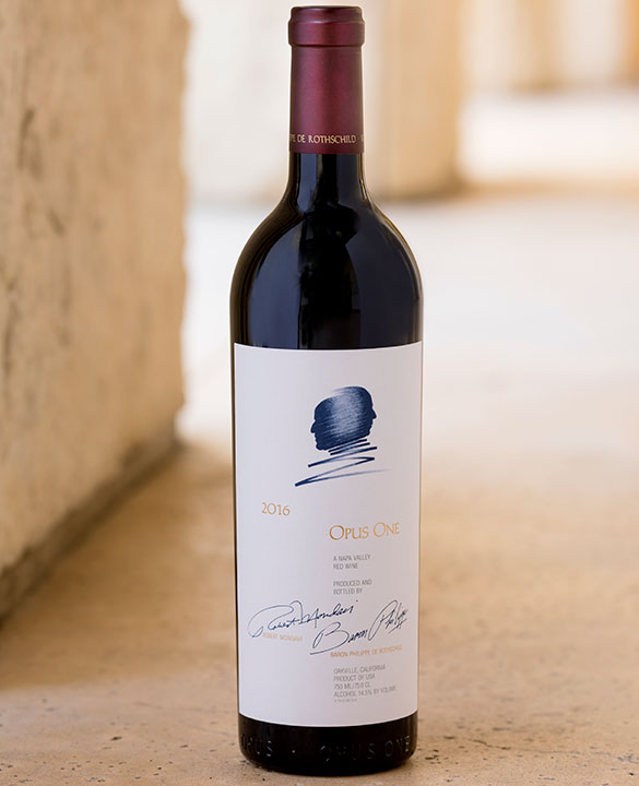 A bottle of 2016 Opus One against a limestone background