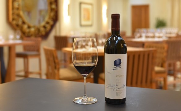 Opus One 2016 in the bottle alongside a glass of Oakville, California red wine in the Opus One salon courtyard.